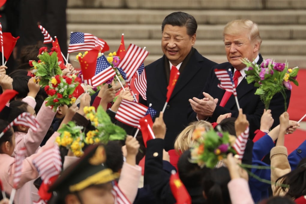 Chinese President Xi Jinping and then-US president Donald Trump participate in a welcome ceremony at the Great Hall of the People in Beijing on November 9, 2017. Photo: AP