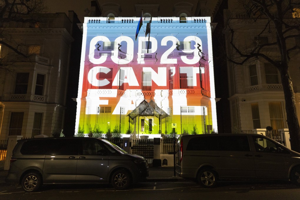 Climate activists project a message onto Azerbaijan’s embassy in London on November 7. Photo: AP