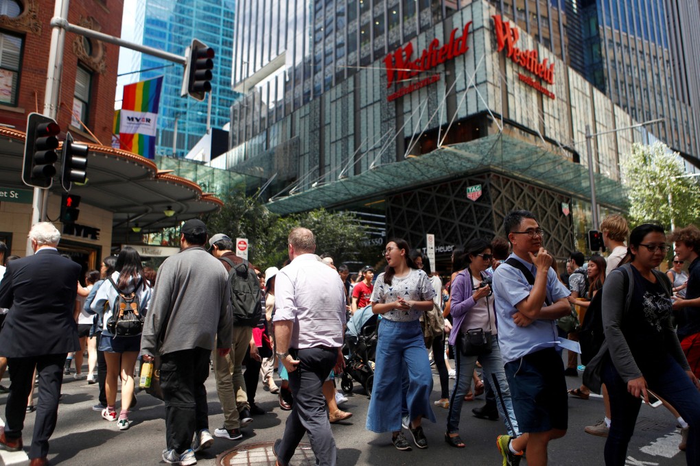 Pedestrians at Sydney’s Westfield shopping centre. A report in February showed the gender pay gap at some of Australia’s biggest firms was bigger than the national average. Photo: Reuters
