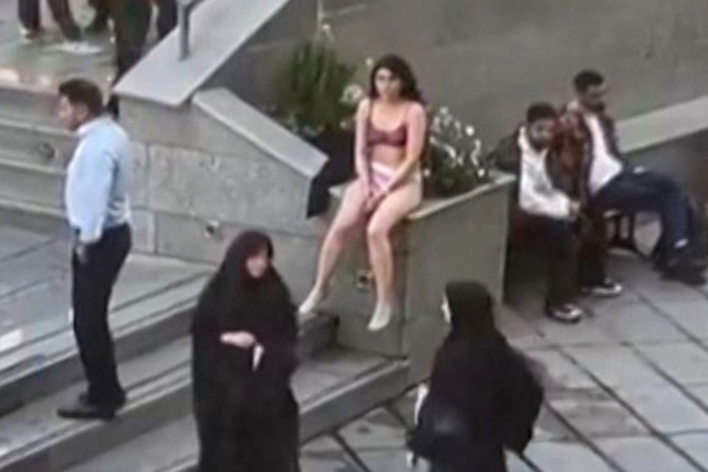 Footage widely shared on social media shows a female student in her underwear outside Tehran’s Islamic Azad University. Photo: UGC via AFP