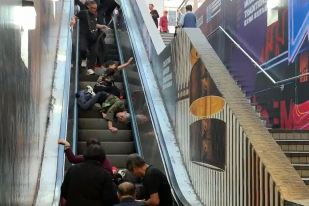 A video circulating online showed several people sprawled on a halted escalator at an exit of the East Tsim Sha Tsui MTR station in Hong Kong. Photo: SCMP