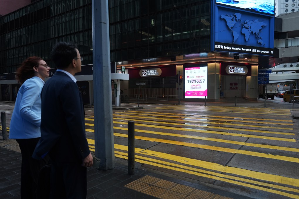 An electronic monitor displays the Hang Seng Index. The benchmark has lost 15 per cent since reaching a recent high in October. Photo:  Sam Tsang