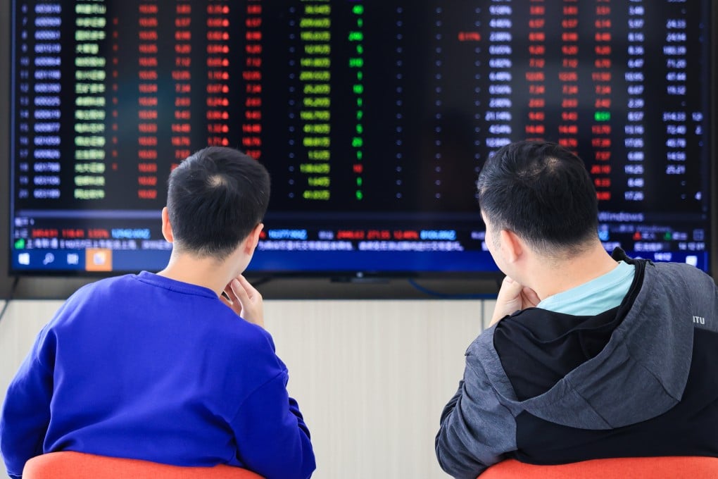 Investors watch stock market trends at a securities firm in Nanjing, in east China’s Jiangsu province. A cross-border stock scheme, which is marking its 10th anniversary, provides mainland investors with new avenues to channel their money. Photo: Xinhua
