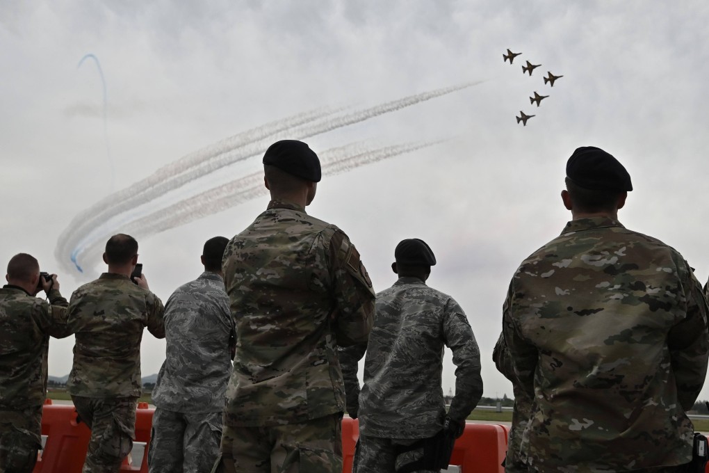 US soldiers watch an aerobatic performance in Pyeongtaek. A South Korean teenager’s jaw was broken in an assault by an American sergeant last week. Photo: AFP