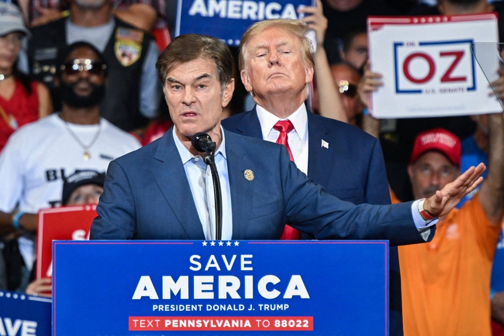 Mehmet Oz speaks as Donald Trump stands behind him during a campaign rally in Wilkes-Barre, Pennsylvania, in September 2022. Photo: AFP