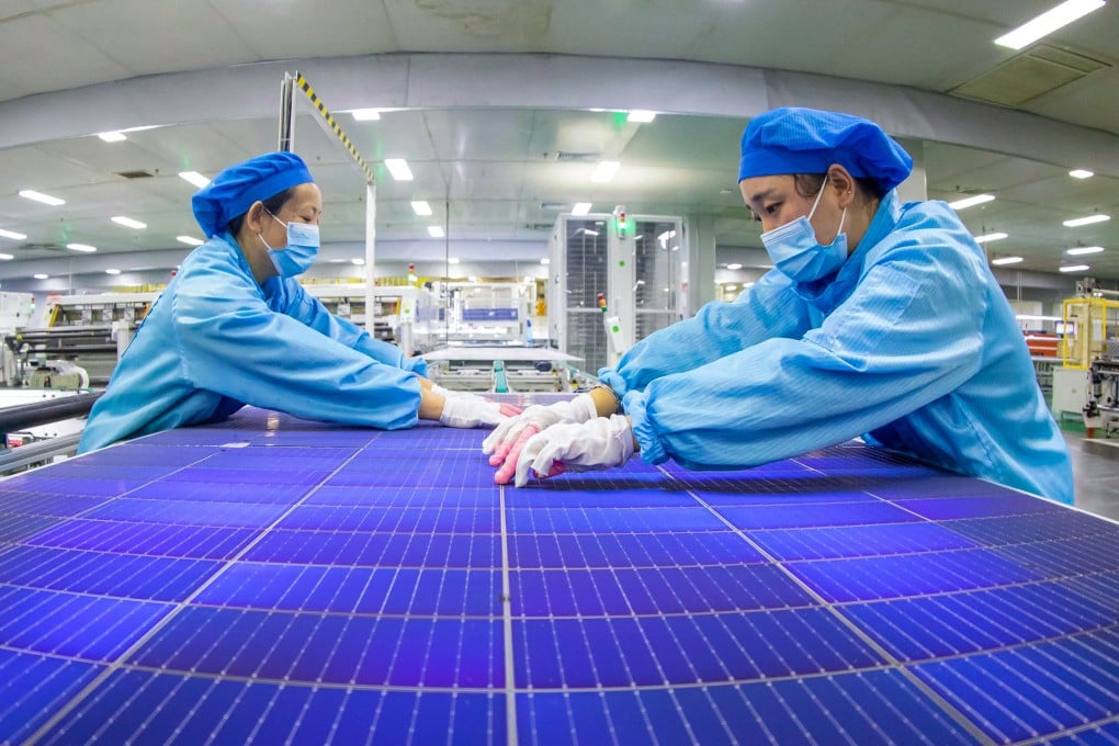 Employees work on solar photovoltaic modules in China’s Jiangsu province. Photo: AFP