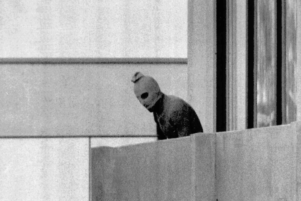 A Palestinian terrorist on a balcony at the Olympic Village in Munich where his group held Israeli athletes hostage. The Black September attack in 1972 is the subject of new thriller September 5. Photo: AP