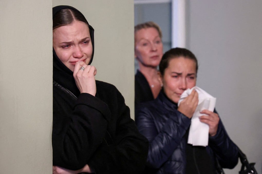 Mourners attend a farewell service before the funeral of Vladimir Shklyarov in St Petersburg, Russia. Photo: Reuters