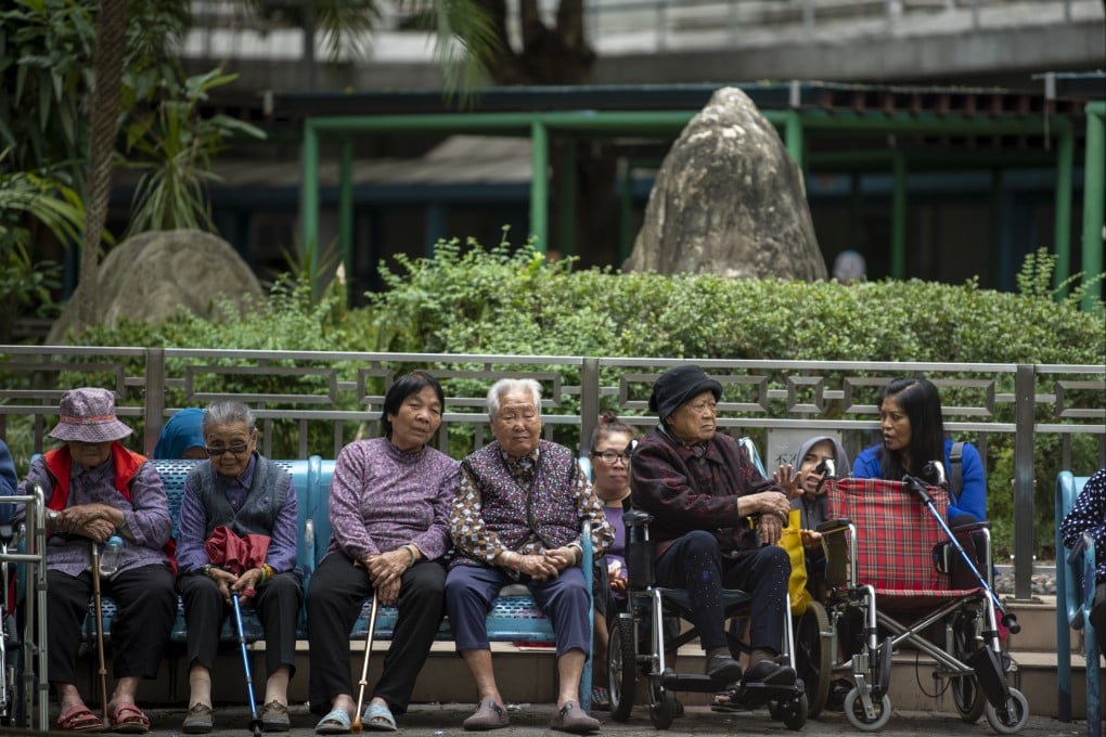 Elderly women sit on a bench in a housing estate in Hong Kong in April 2019. The demand for barrier-free facilities and services will grow in Hong Kong amid population ageing. Photo: Getty Images