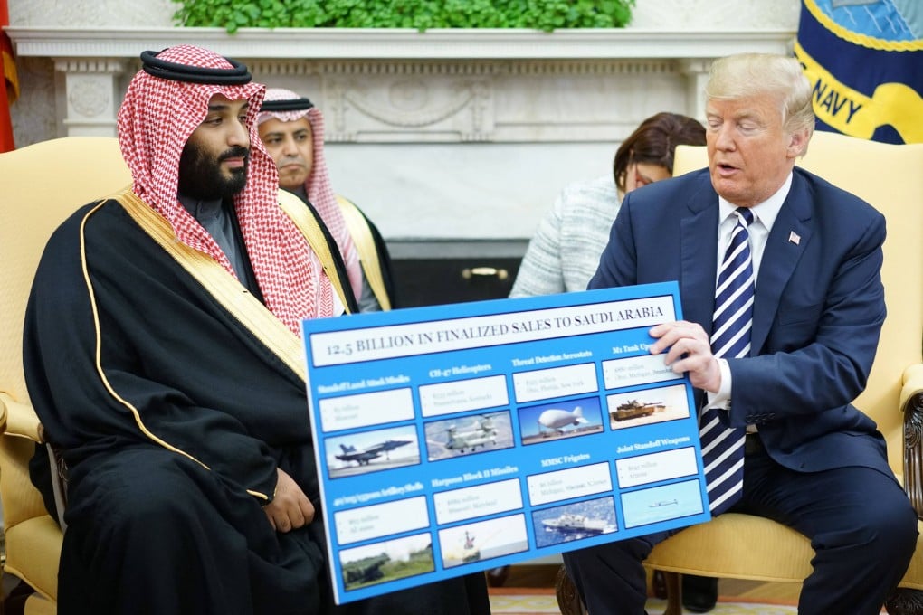 Then-US president Donald Trump holds a chart showing defence sales next to Saudi Arabian Crown Prince Mohammed bin Salman in Washington, on March 20, 2018. Photo: AFP