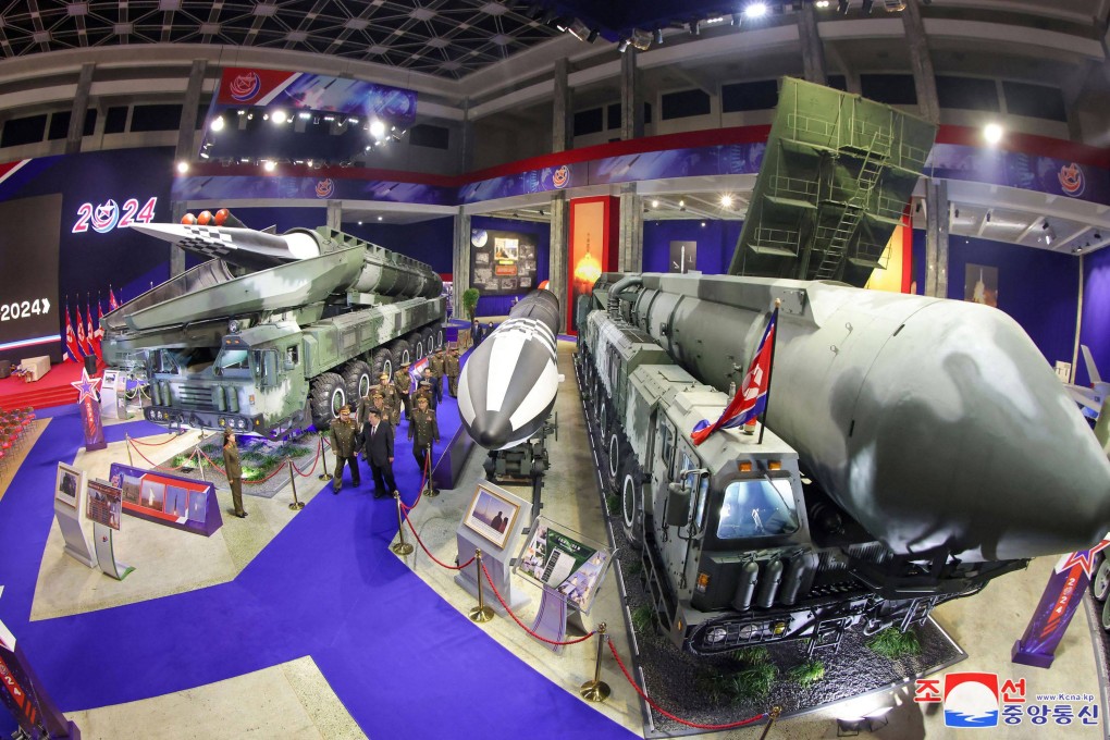 North Korean leader Kim Jong-un (front centre) visits a defence exhibition in Pyongyang on November 21. Photo: KCNA via KNS/AFP