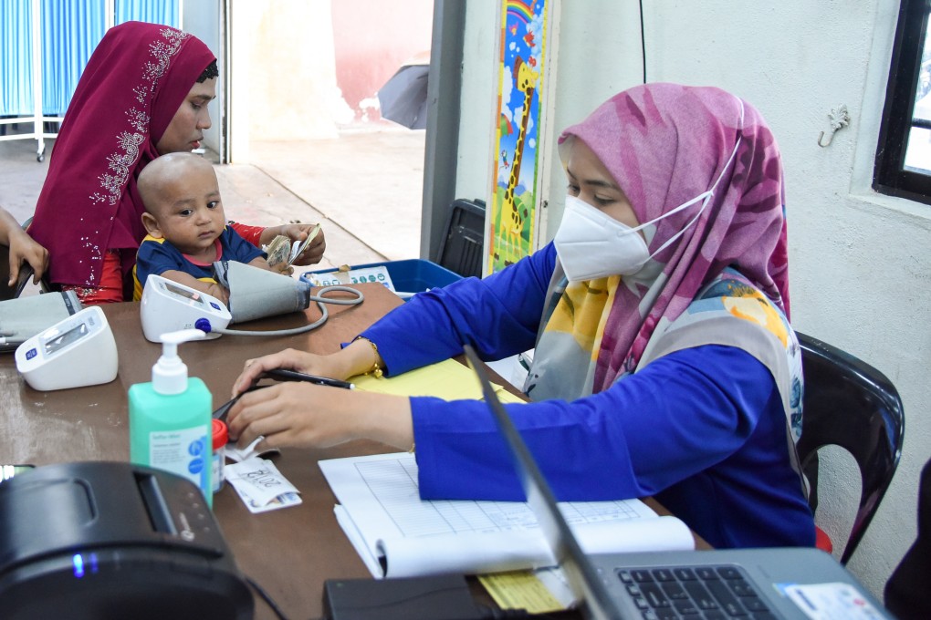 Nor Anis Syazwani collects preliminary health data upon patients’ arrival at an MSF mobile clinic in Penang, Malaysia. Photo: Steven Ooi/MSF