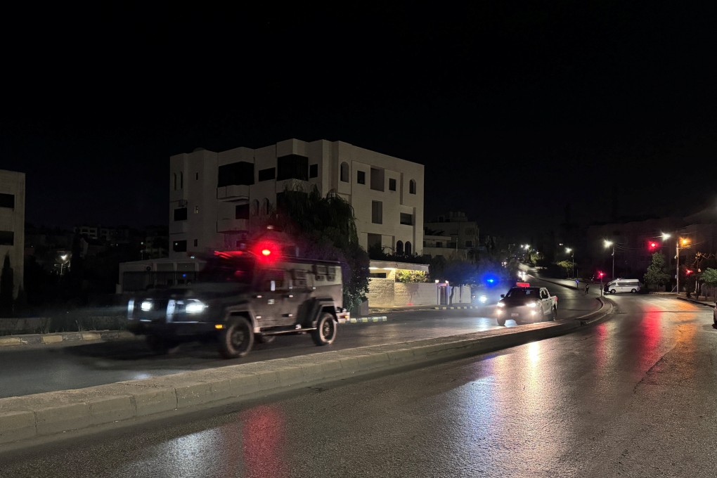 Police vehicles on a street near the Israeli embassy in Amman, Jordan following the shooting. Photo: Reuters