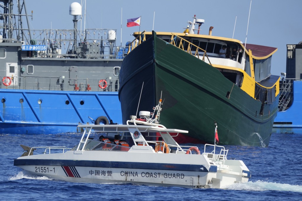 A Philippine resupply vessel (in green) encounters a Chinese coastguard boat near the Second Thomas Shoal, locally known as Ayungin Shoal, in the disputed South China Sea. China has repeatedly impeded Manila’s missions to repair and resupply the BRP Sierra Madre grounded at the shoal. Photo: AP