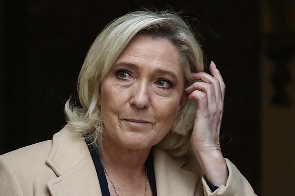 French President of far-right party Rassemblement National parliamentary group Marine Le Pen leaves after a meeting with the French Prime Minister in Paris on November 25. Photo: AFP