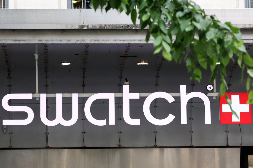 Logo of Swiss watchmaker Swatch Group is pictured on a store in Geneva, Switzerland. Photo: Reuters