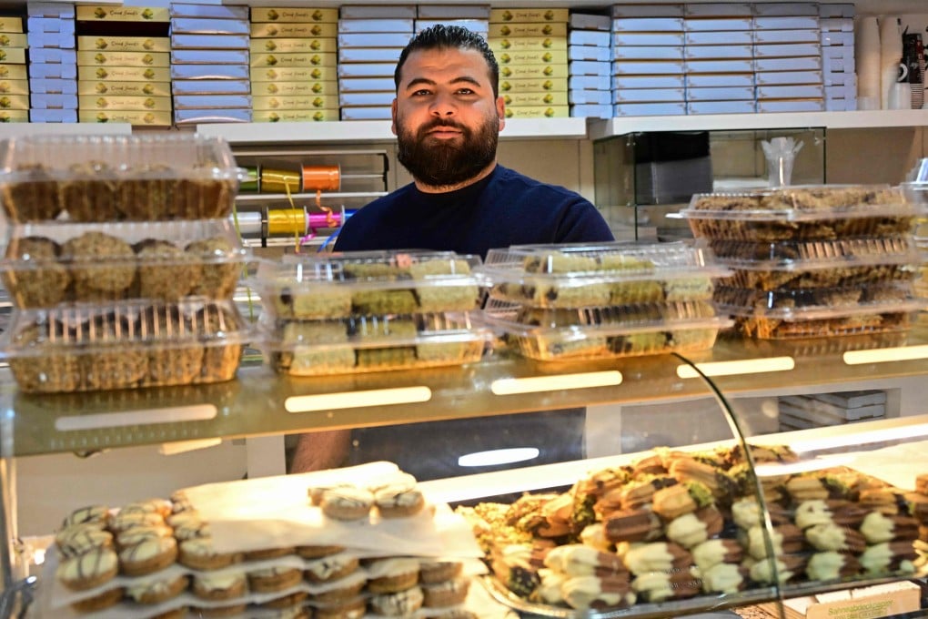 Ali Fakhro behind the counter at his shop Abu Khaled Sweets in Berlin, Germany. Fakhro can’t keep up with demand for “Dubai chocolate”, viral pistachio-filled bars that can be resold online for over US$100. Photo: AFP