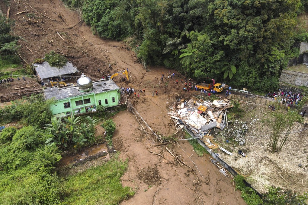 Mud, rocks and trees tumbled down a mountain after torrential rains. Photo: AP