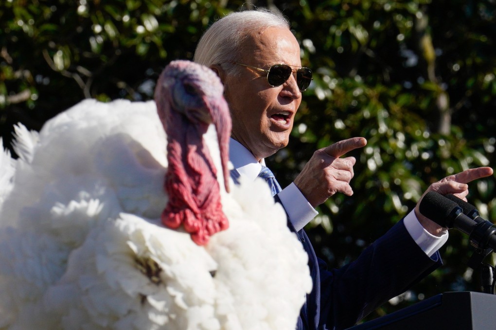 US President Joe Biden, and one of the two National Thanksgiving turkeys. Photo: EPA-EFE