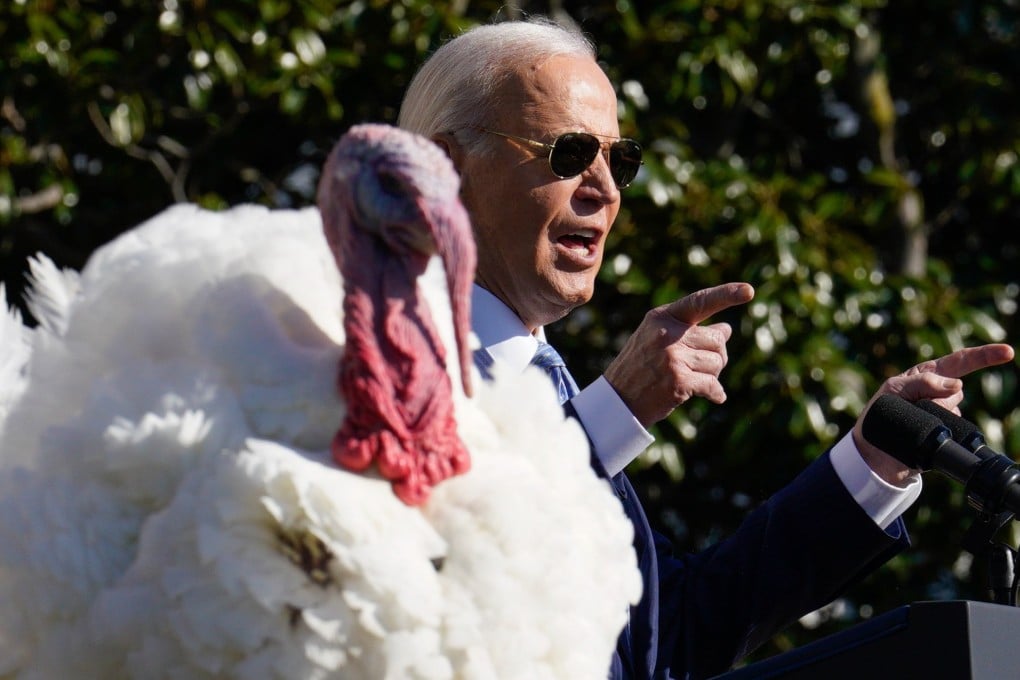US President Joe Biden, and one of the two National Thanksgiving turkeys. Photo: EPA-EFE