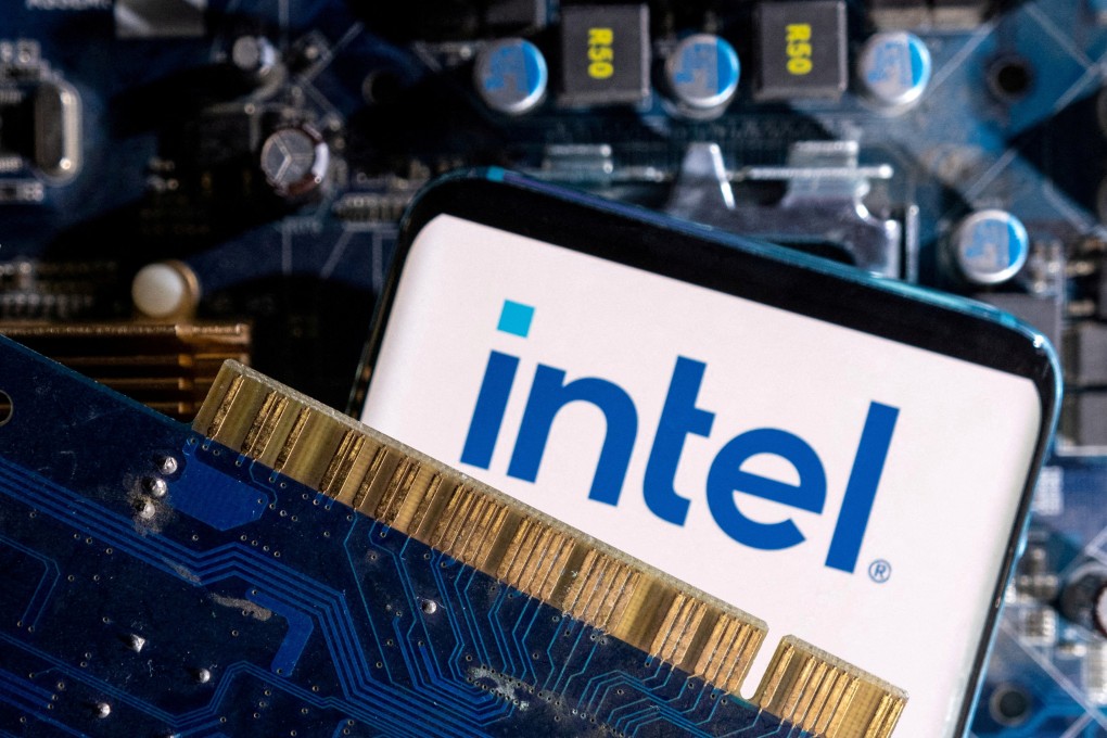 A smartphone with a displayed Intel logo is placed on a computer motherboard. Photo: Reuters
