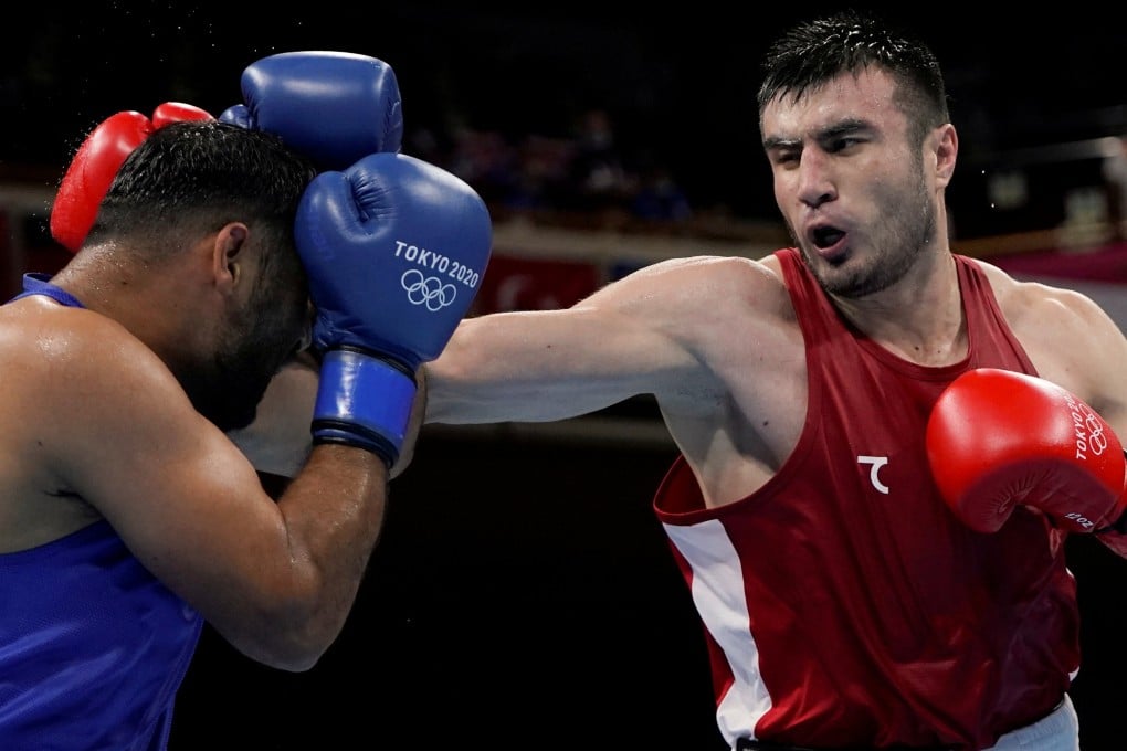 Bakhodir Jalolov of Uzbekistan (right) in action against India’s Satish Kumar at the Tokyo Olympics. Uzbekistan, one of the most successful Olympic boxing nations, has joined the new Asian body. Photo: Reuters
