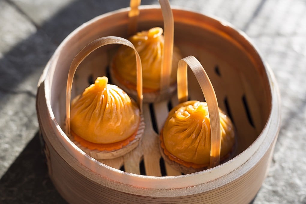 Chef Leung Kwok-wah has married two beloved dishes at Dim Sum Library, combining xiao long bao with the spicy broth from Hutong’s dan dan noodles. Photo: Handout