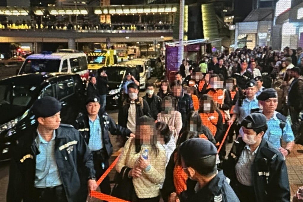 Hong Kong police escorting suspects from a building in Central. Photo: Handout