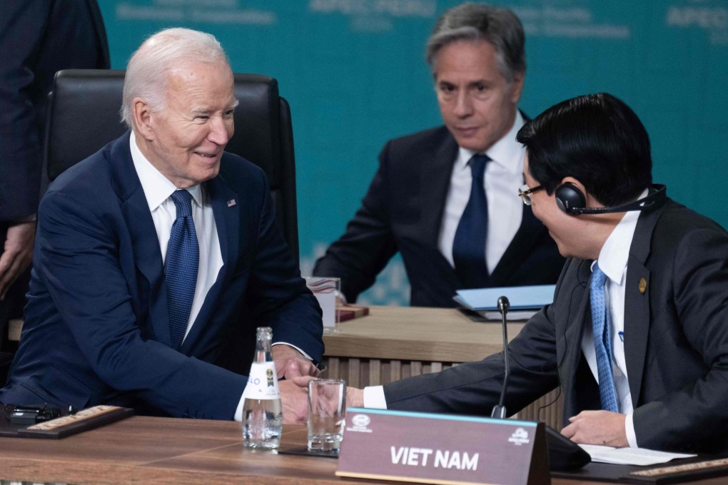 US President Joe Biden shakes hands with Vietnam’s President Luong Cuong at the APEC summit in Lima on November 15. Photo: AFP