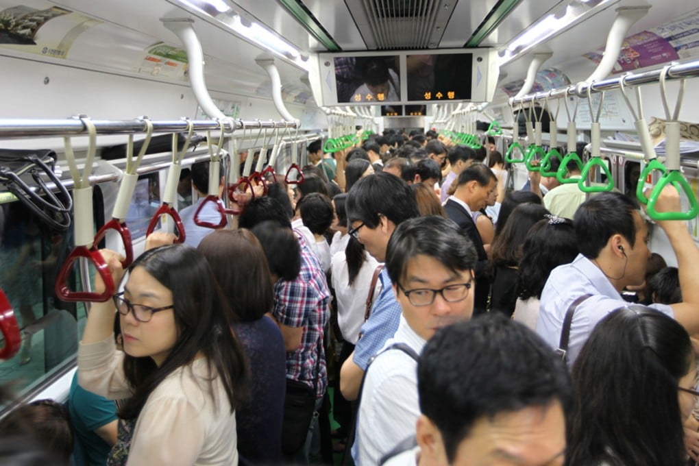 Commuters pack a subway car in Seoul, South Korea. Photo: MCT