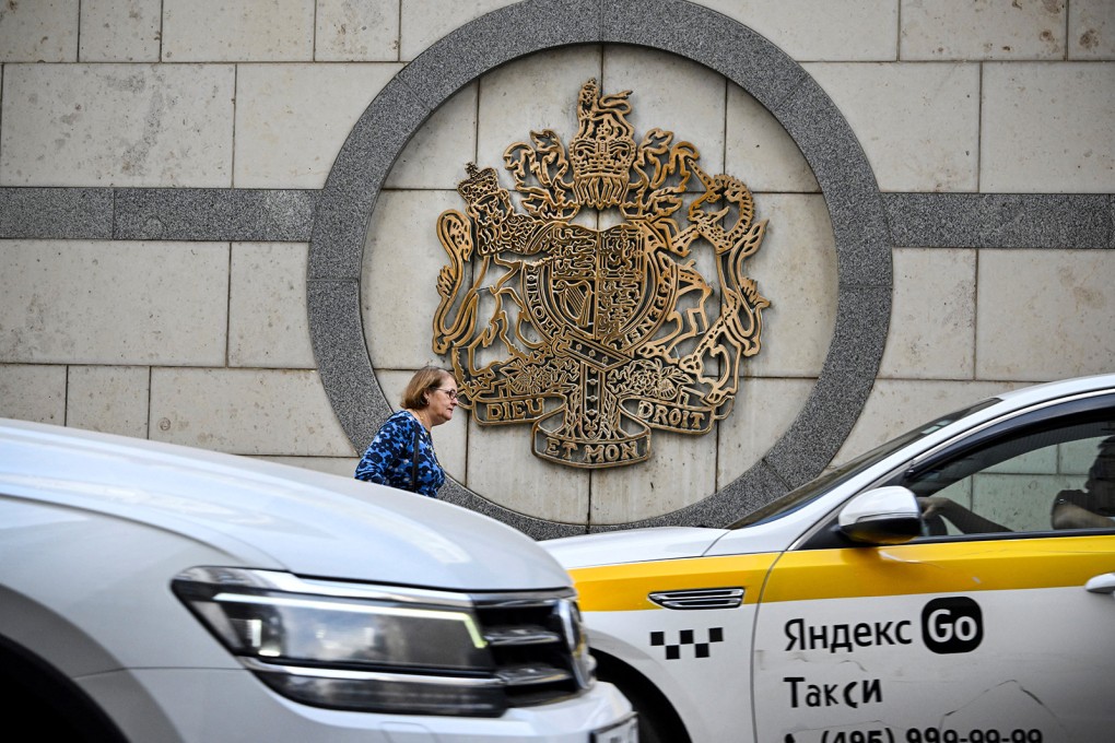 A woman walks outside the British embassy building in Moscow. Photo: TNS