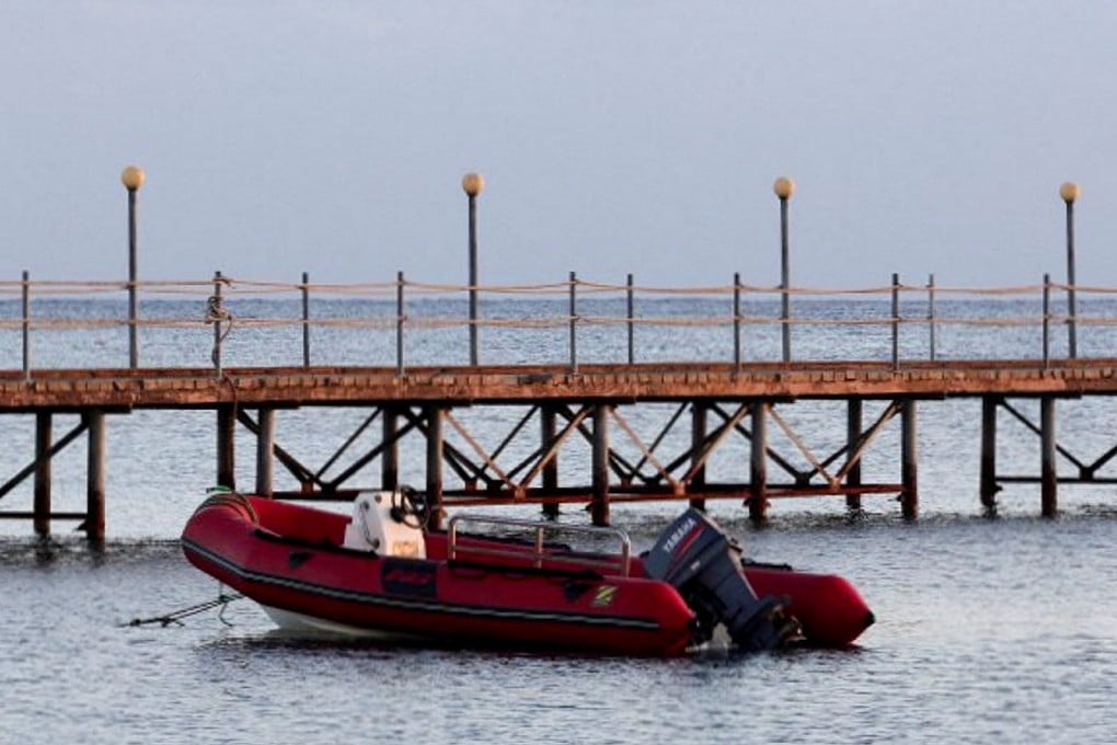 A boat is docked near the beach where survivors from the boat that capsized off Egypt’s Red Sea coast were brought, in Marsa Alam, Egypt on November 26. Photo: Reuters