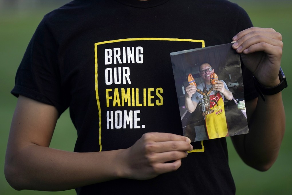 Harrison Li holds a photo of his father, Kai Li, who is being released after years in a Chinese jail. Photo: AP