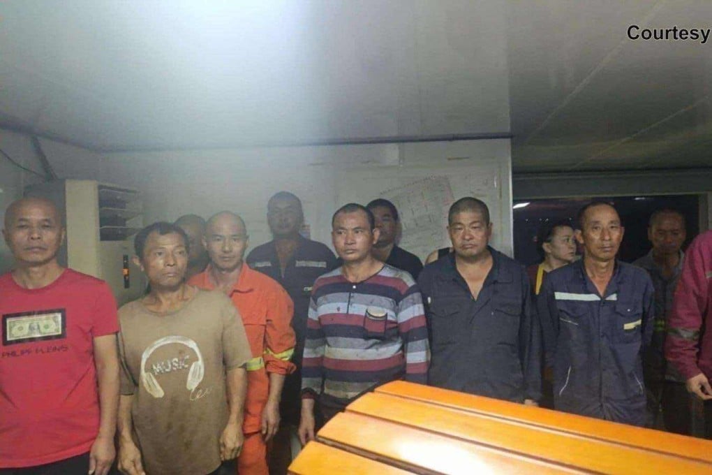 Undocumented Chinese nationals seen inside a dredger vessel on Tuesday off Bataan. Photo: Philippine Coast Guard