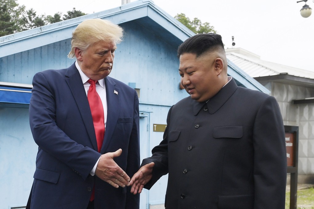 North Korean leader Kim Jong-un and US President Donald Trump prepare to shake hands at the border village of Panmunjom in the demilitarised zone, South Korea, in June 2019. Photo: AP