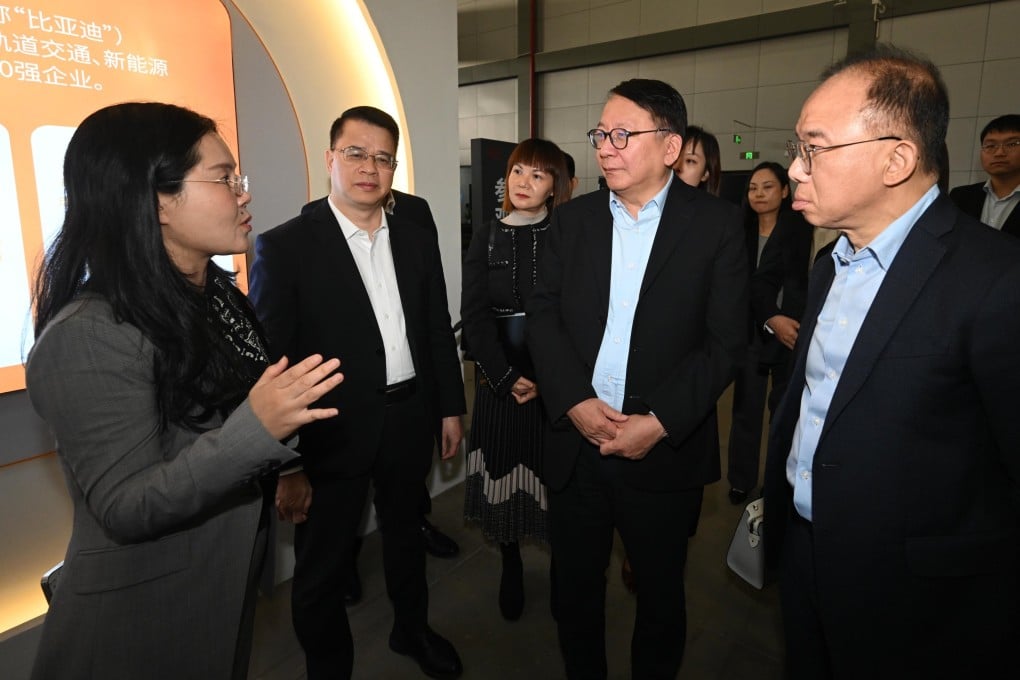 Chief Secretary Eric Chan (second from right) tours the factory of Chinese electric vehicle manufacturer BYD in Shenzhen. Photo: SCMP