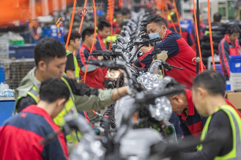 Employees work on a motorcycle assembly line in Chongqing on November 13. Chinese manufacturers hoping to export goods to the US are bracing for higher tariffs with the return of Donald Trump to the White House. Photo: Xinhua