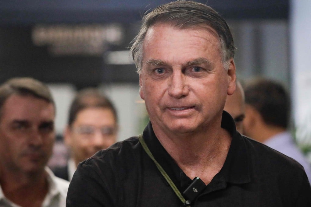 Brazil’s former President Jair Bolsonaro arrives at the airport in Brasilia on Monday. Photo: AFP