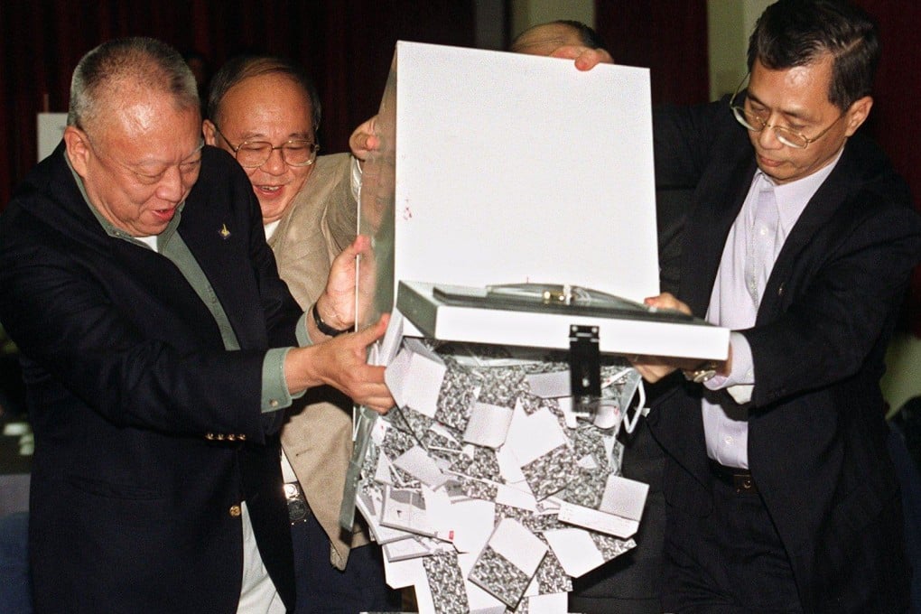 Tung Chee-hwa (far left) opens ballot boxes in Causeway Bay Counting Centre on November 28, 1999. Photo: K. Y. Cheng