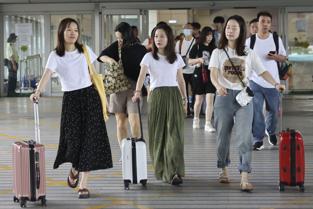 Travellers arrive from mainland China via the Shenzhen Bay border on the first day of the Labour Day holiday week. Photo: Dickson Lee