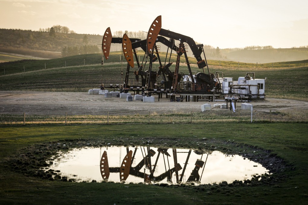 Pumpjacks draw out oil and gas from well heads in Alberta, Canada. Photo: AP