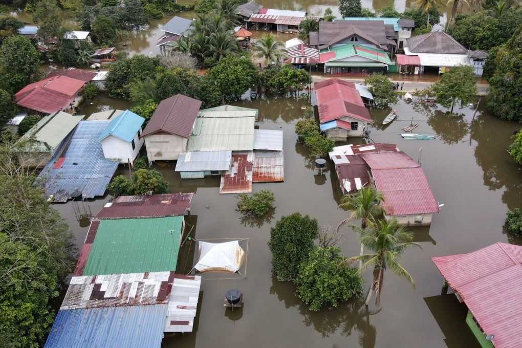 A file photo of flooded houses in Tersang village in Rantau Panjang town on December 15, 2022. Photo: dpa/file