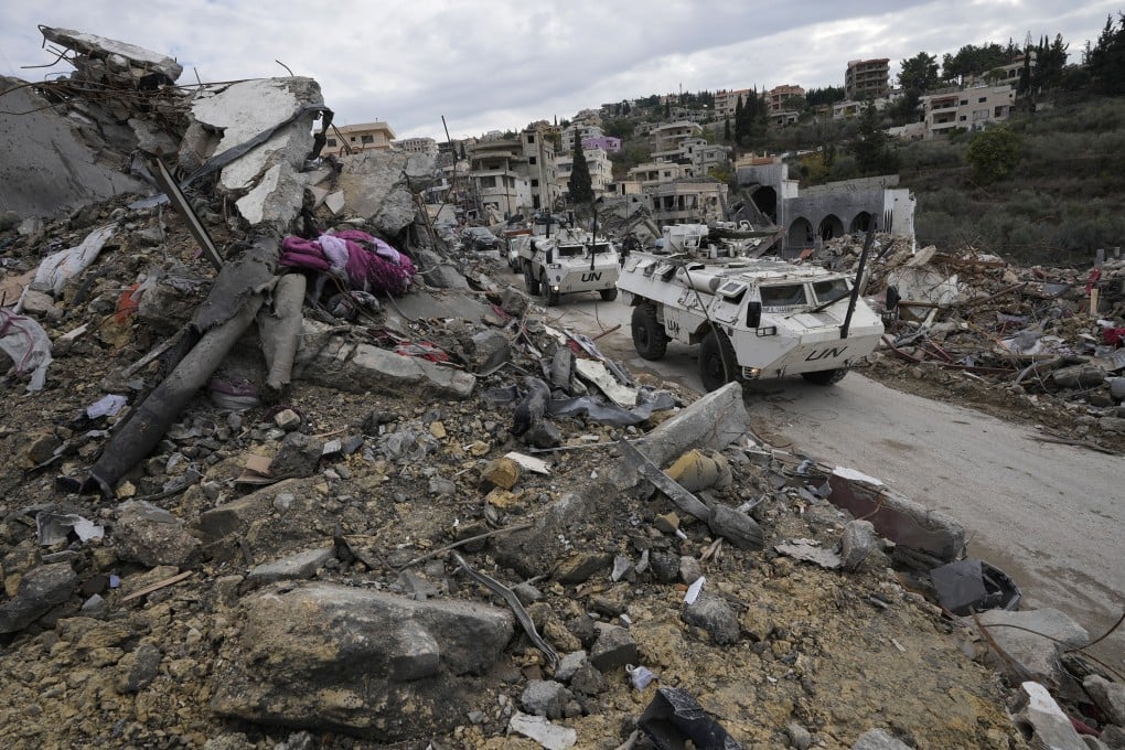 A South Korean UN peacekeeper patrol drive past destroyed buildings in Chehabiyeh village, southern Lebanon. Photo: AP