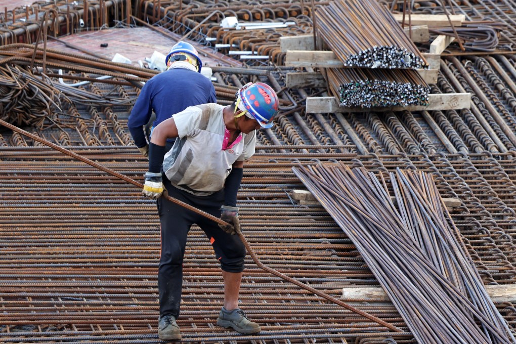 Construction workers on a site in Central. Photo: Jelly Tse
