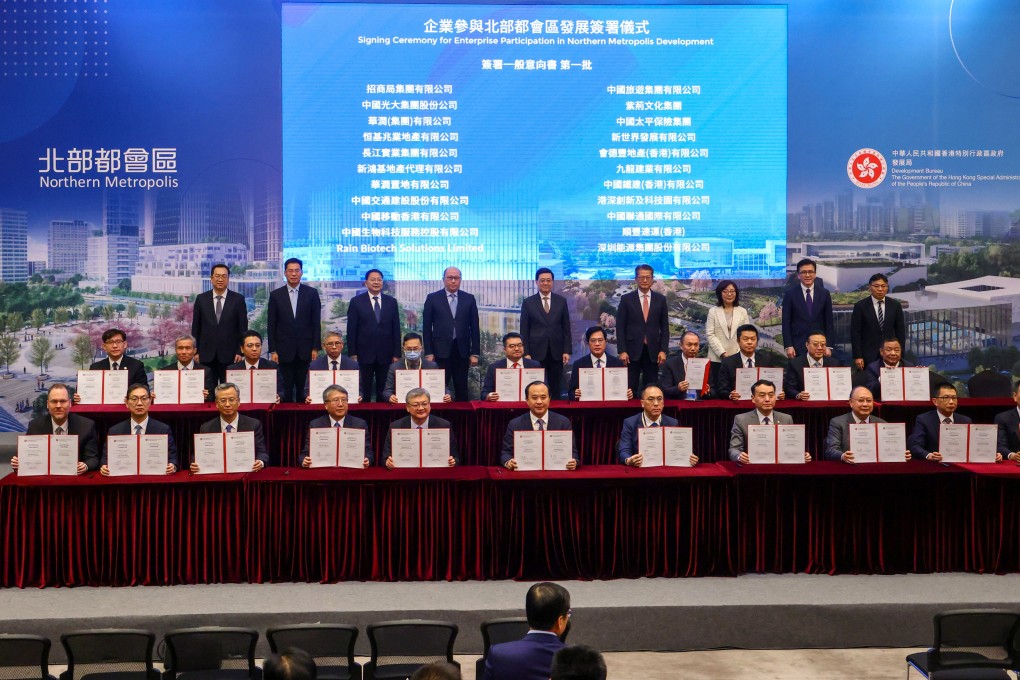 Business leaders display MOUs signed on Friday. Photo: Dickson Lee