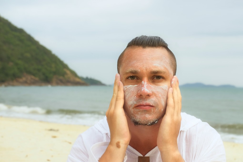 Man applies sun block. Skin cancer sites are known to release volatile organic compounds – organic chemicals which easily evaporate. Photo: Shutterstock