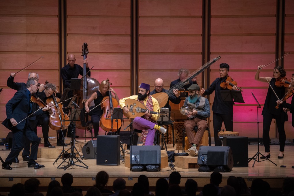 The Australian Chamber Orchestra joined by oud virtuoso Joseph Tawadros (seated; purple trousers). Photo: Nic Walker