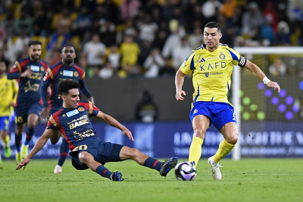 Cristiano Ronaldo, in action against Damac’s Dhari Al-Enezi, has led Saudi Arabia’s Al Nassr to the top three of the western zone of the AFC league. Photo: Reuters