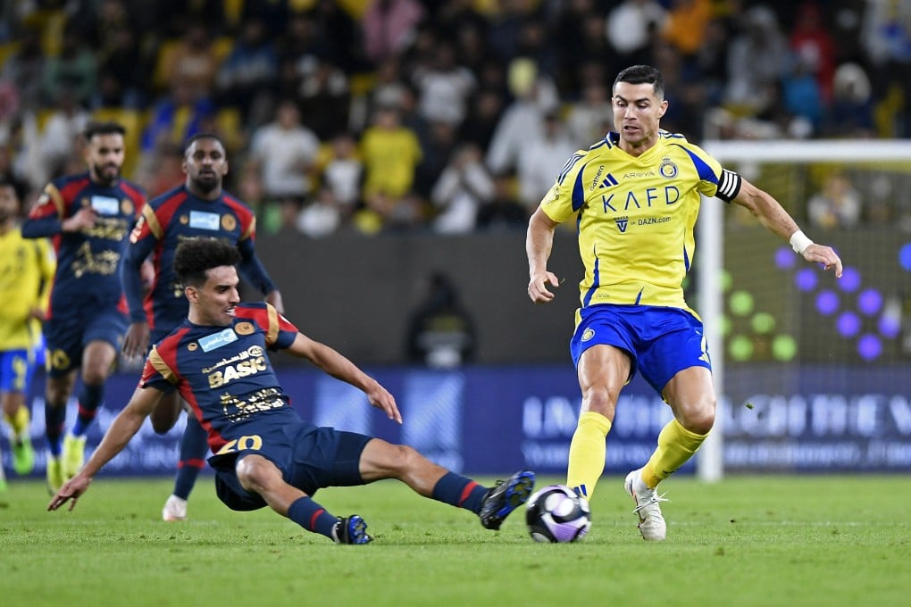 Cristiano Ronaldo, in action against Damac’s Dhari Al-Enezi, has led Saudi Arabia’s Al Nassr to the top three of the western zone of the AFC league. Photo: Reuters