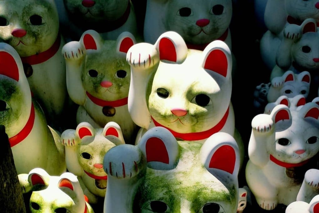 Cat figurines, called maneki neko, on display at Tokyo’s Gotokuji Temple. Photo: X